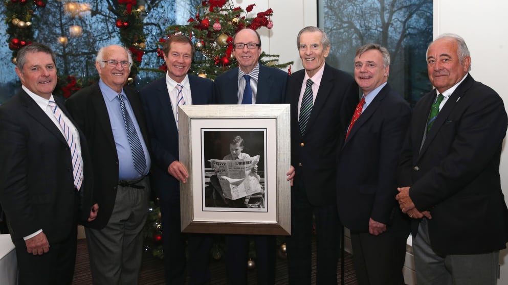 Mitchell Platts, centre, receives a gift at the Golfer of the Year lunch in 2013 from senior executives and board members of the European Tour. (L-R) Scott Kelly,  Neil Coles, George O’Grady,  Mark Wilson, Ken Schofield, and Angel Gallardo.
