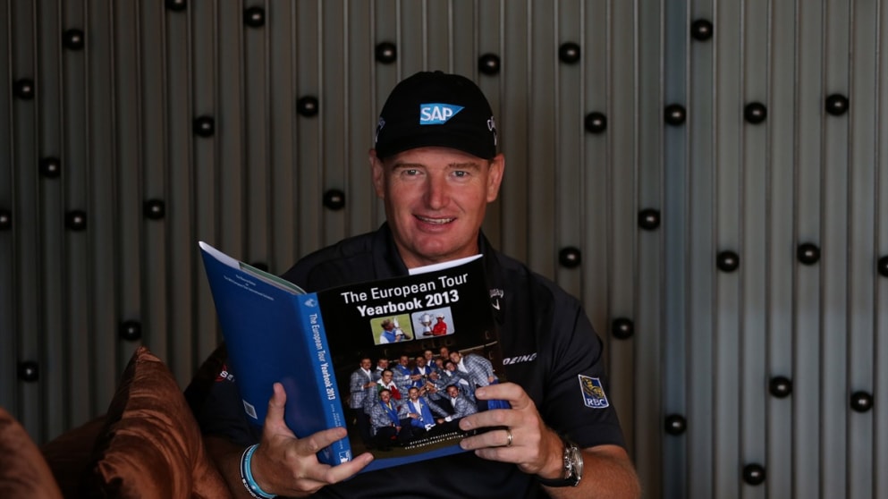 Ernie Els enjoys an early look at the 2013 yearbook