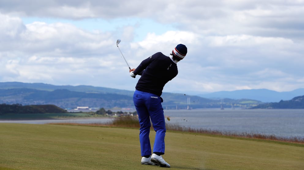 Matteo Manassero of Italy hits his 3rd shot on the 18th hole