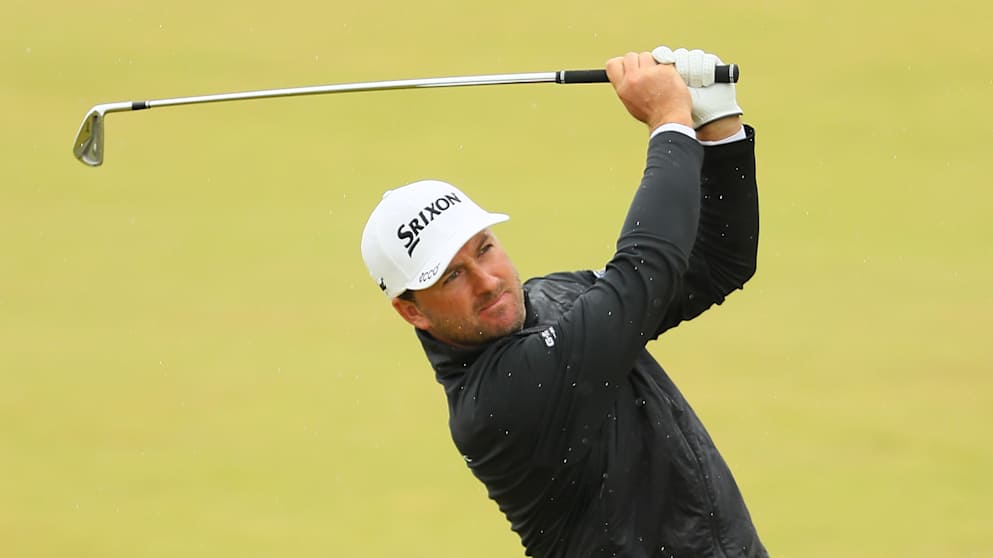 Graeme McDowell of Northern Ireland hits his 2nd shot on the 1st hole