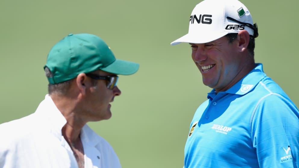 Lee Westwood smiles alongside caddie Billy Foster