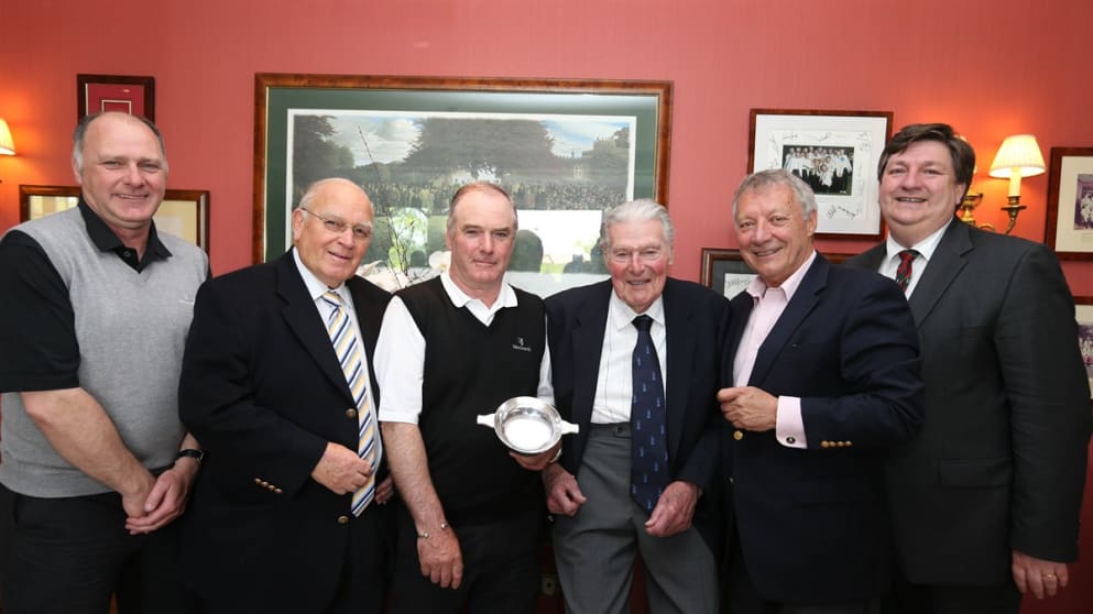 Chris Kennedy receives a silver Quaich from John Jacobs and the AGW