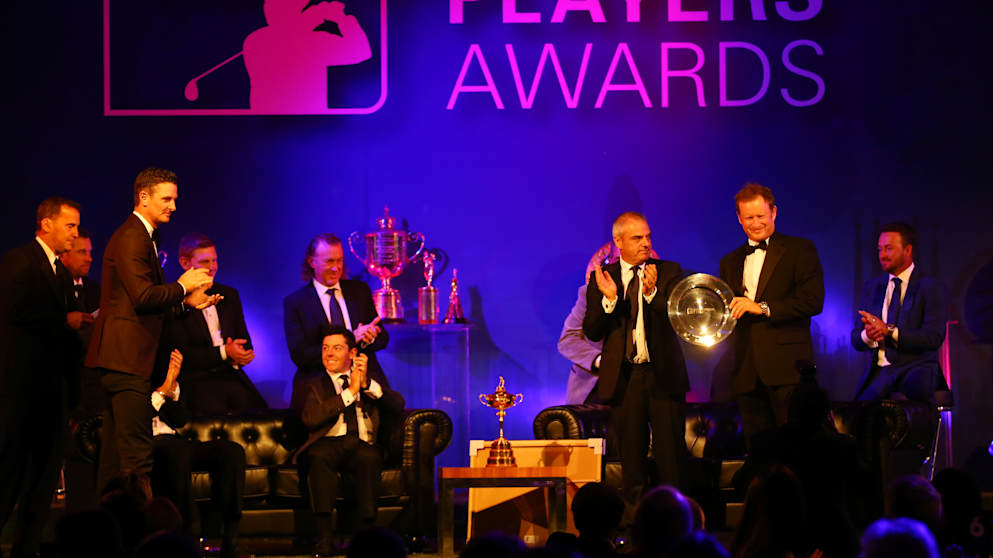 Jamie Donaldson receives the Shot of the Year award from Paul McGinley