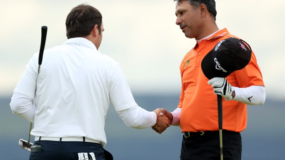 Jeev Milkha Singh shakes hands with Francesco Molinari