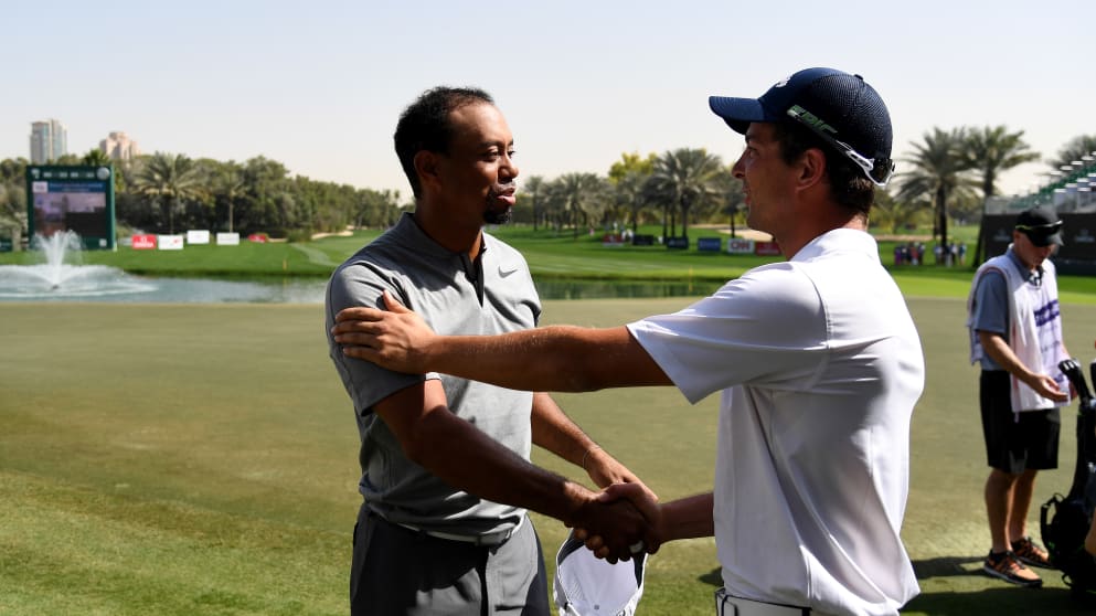 Tiger Woods chatting to Sebastien Gros in Dubai