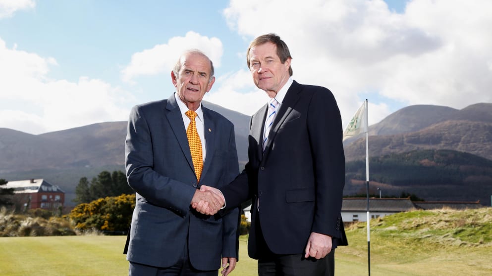 Colm McLaughlin (L), Executive Vice Chairman of Dubai Duty Free, shakes hands with The European Tour's Chief Executive George O'Grady (R)