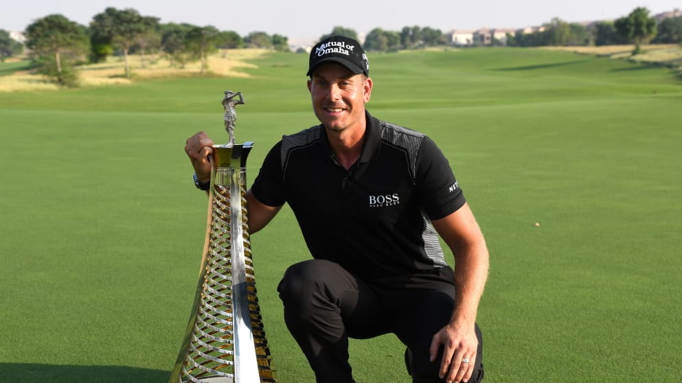 Henrik Stenson celebrates with the Race to Dubai trophy