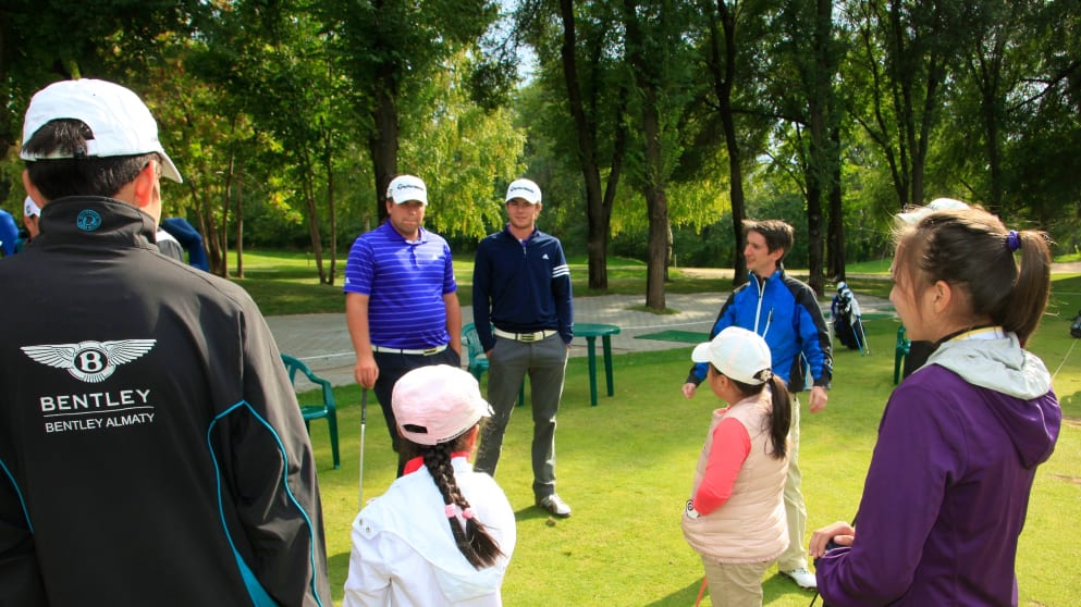 Young Kazakh kids receive golf lessons during the 2013 Kazakhstan Open from Jack Senior (centre left) and Laurie Canter (centre right) (Phil Inglis)