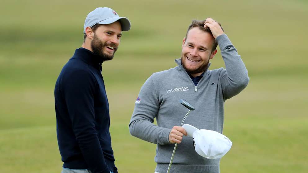 Jamie Dornan and Tyrrell Hatton during the final round of the Alfred Dunhill Links Championship