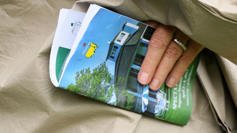 A patron with a spectator's guide at Augusta National