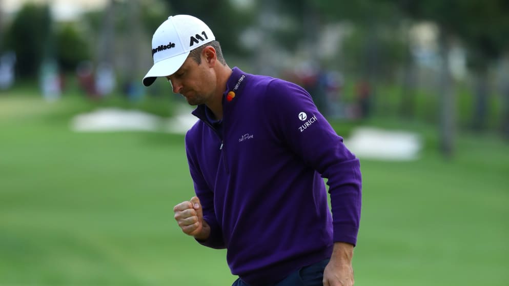 Justin Rosecelebrates a birdie on the 18th green 