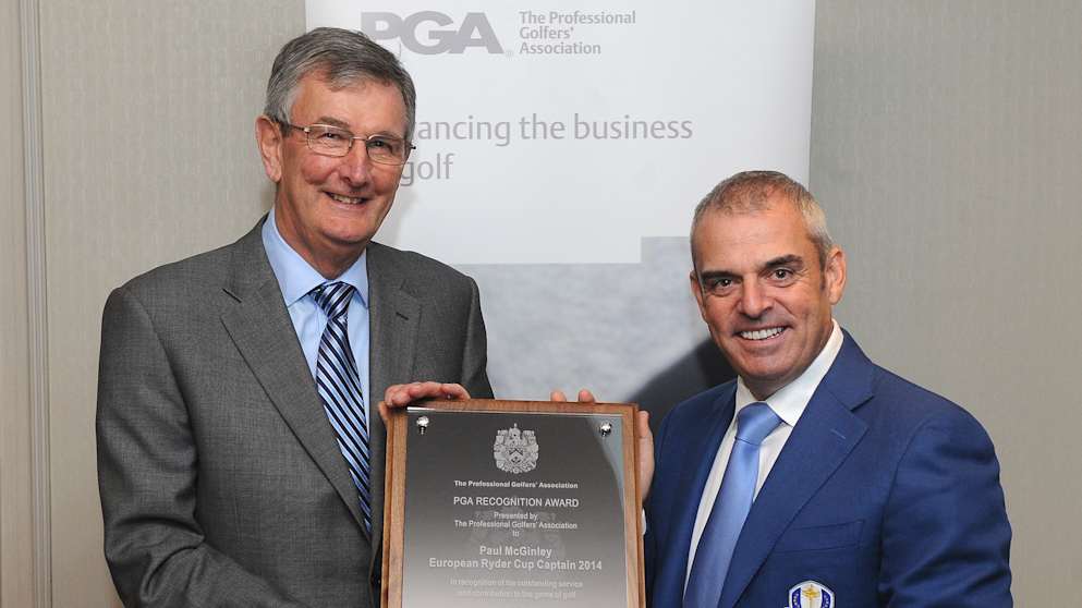 Paul McGinley receiving his award from PGA captain Neil Selwyn-Smith 
