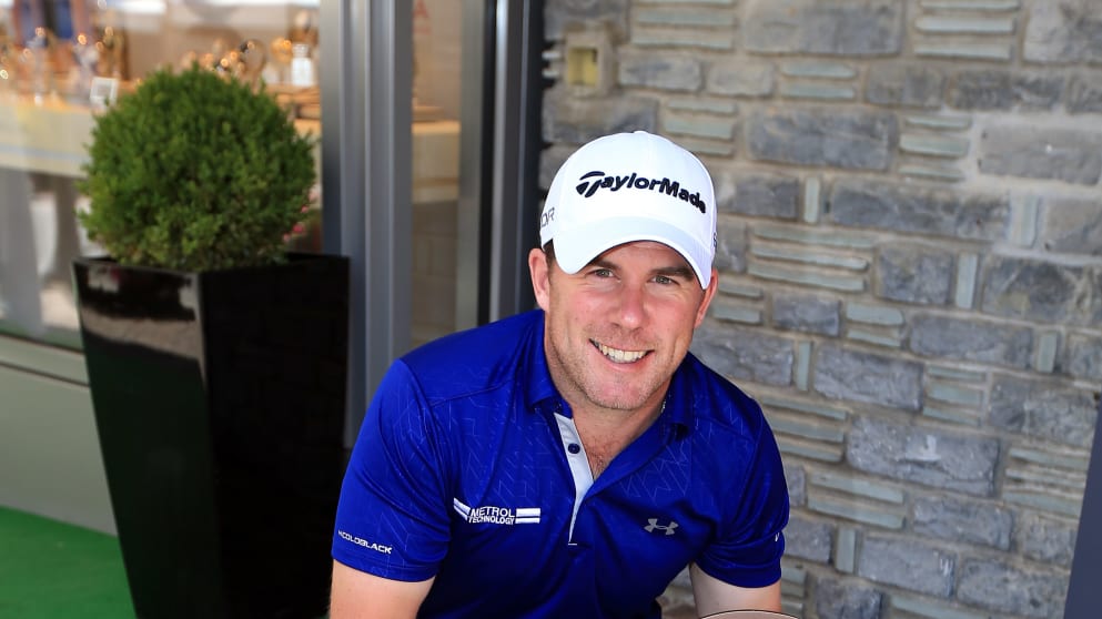  Richie Ramsay of Scotland places his winners plaque into the pavement