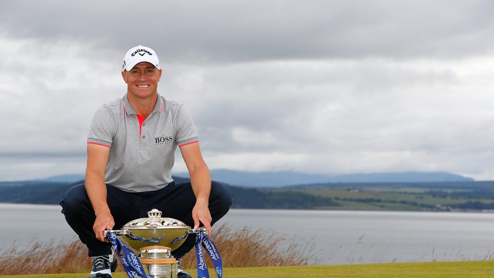 Alex Noren - poses with the Aberdeen Asset Management Scottish Open trophy 