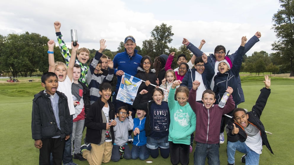 Luke Donald with the Game Changers who designed the 16th pin flag