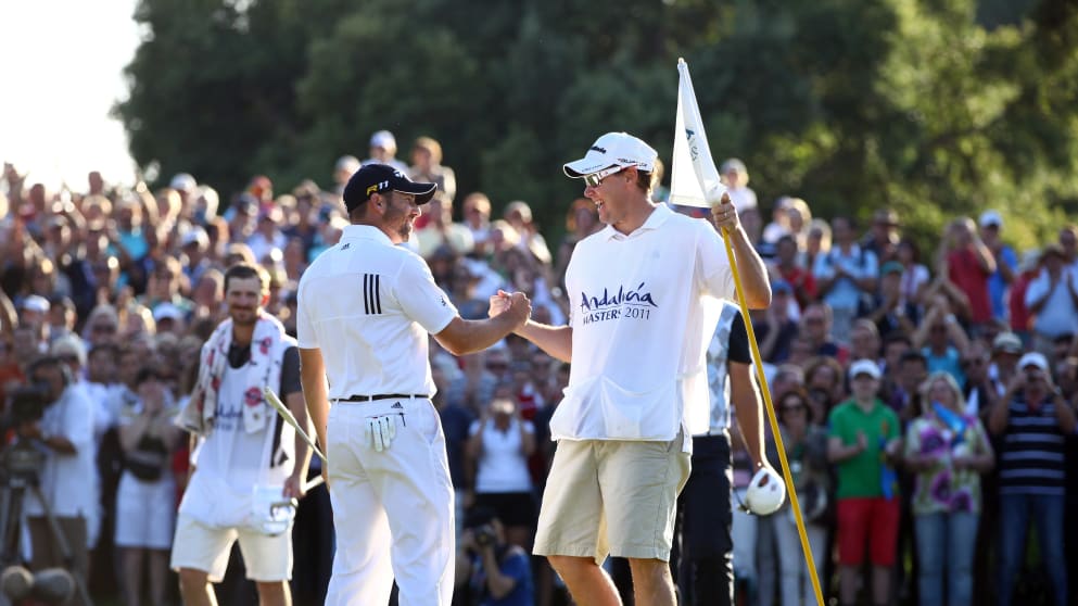 Sergio Garcia celebrates with his caddie at the 2011 Andalucia Masters