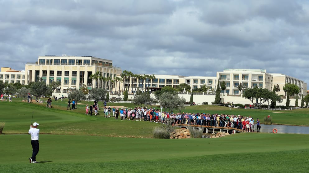 Thomas Bjorn of Denmark plays his second shot on the 14th hole