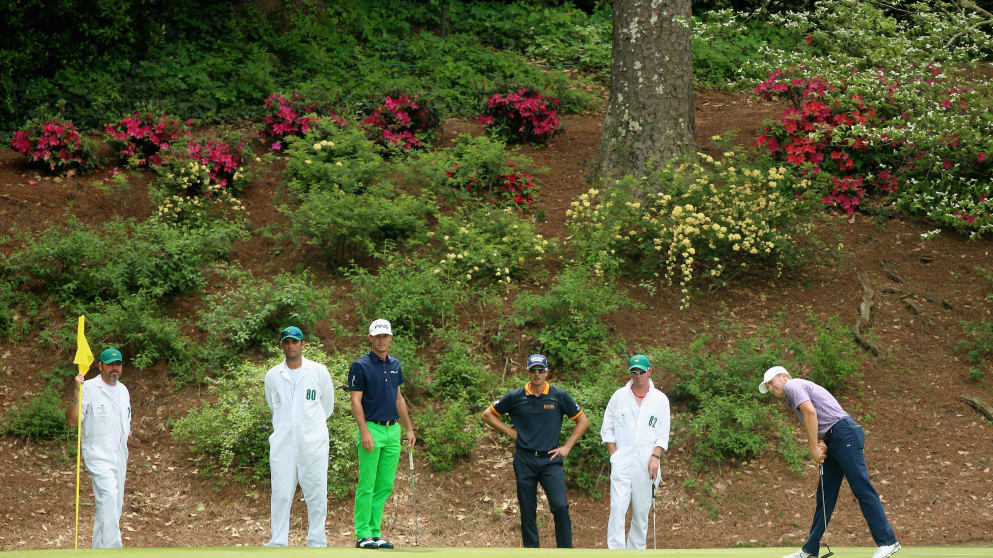 Jordan Spieth is watched by playing partners Billy Horschel and Henrik Stenson