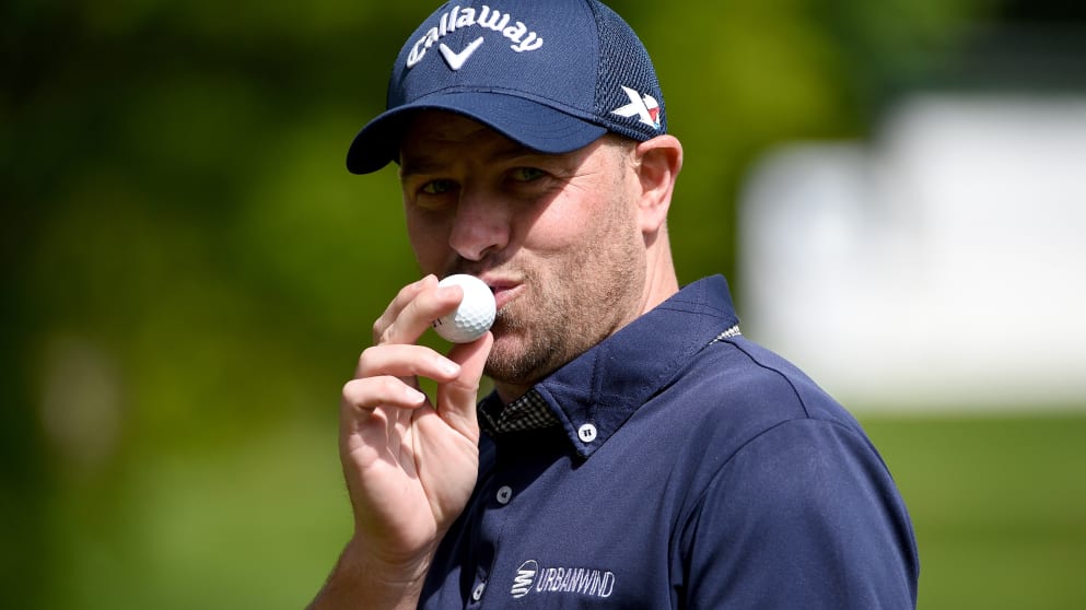 Craig Lee celebrates a hole in one on the second