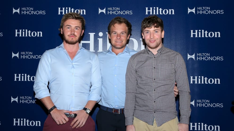 Alex Nicholls and Kain Craigs pose with Tyrrell Hatton on their trip to Dubai courtesy of Hilton