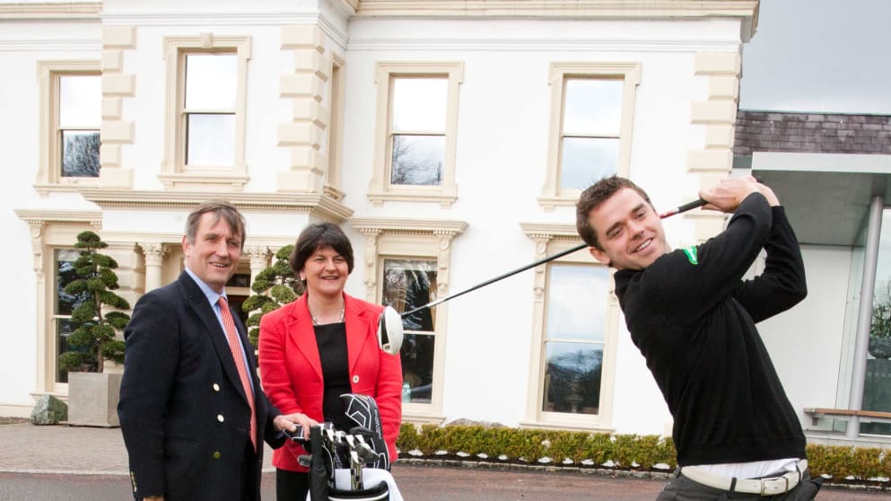 Gareth Shaw, far right, shows off his swing to Christopher Brooke of Galgorm Castle and Arlene Foster, Northern Ireland's Minister for Enterprise, Trade and Investment