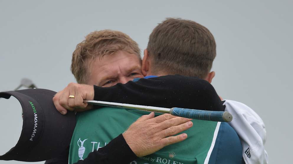 Paul Broadhurst celebrates victory at the Senior Open Championship with son Sam