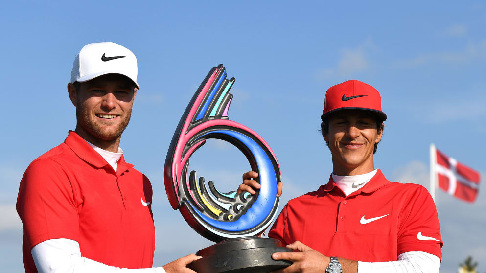 Thorbjorn Olesen and Lucas Bjerregaard - pose with the trophy after winning the Golf Sixes