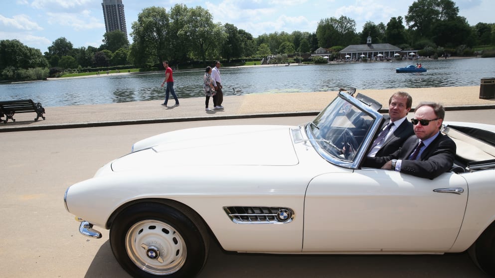 Dr Ian Robertson, Member of the Board of Management of BMW AGM, Sales and Marketing, (left) and George OGrady driving off in a BMW 507 in Hyde Park