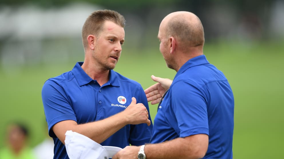 Henrik Stenson, left, is congratulated by Thomas Bjørn