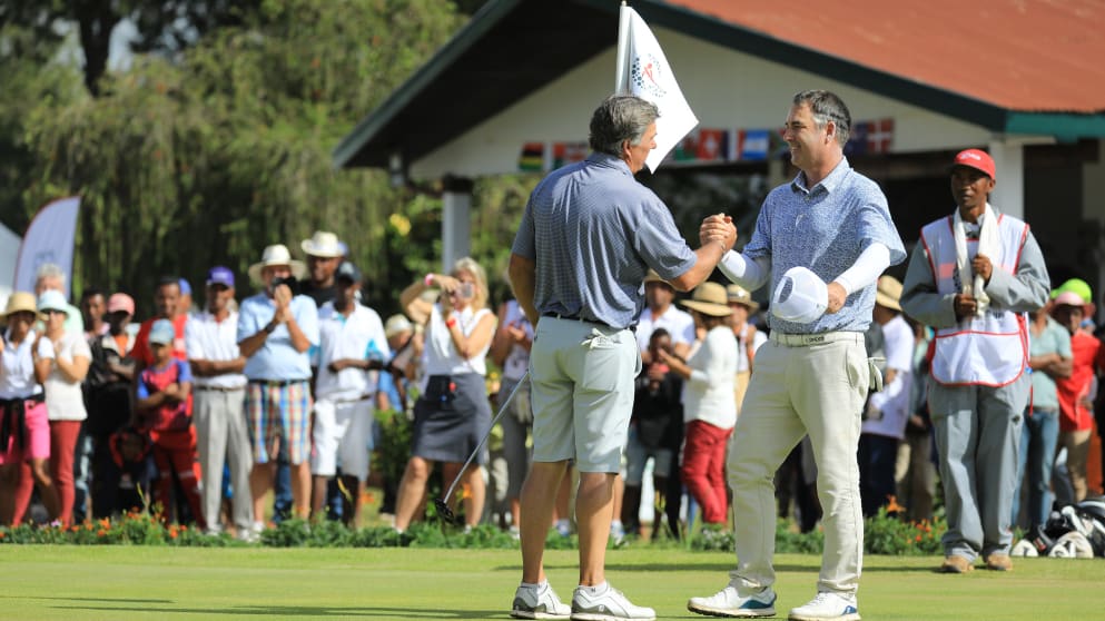 Barry Lane congratulated by Clark Dennis