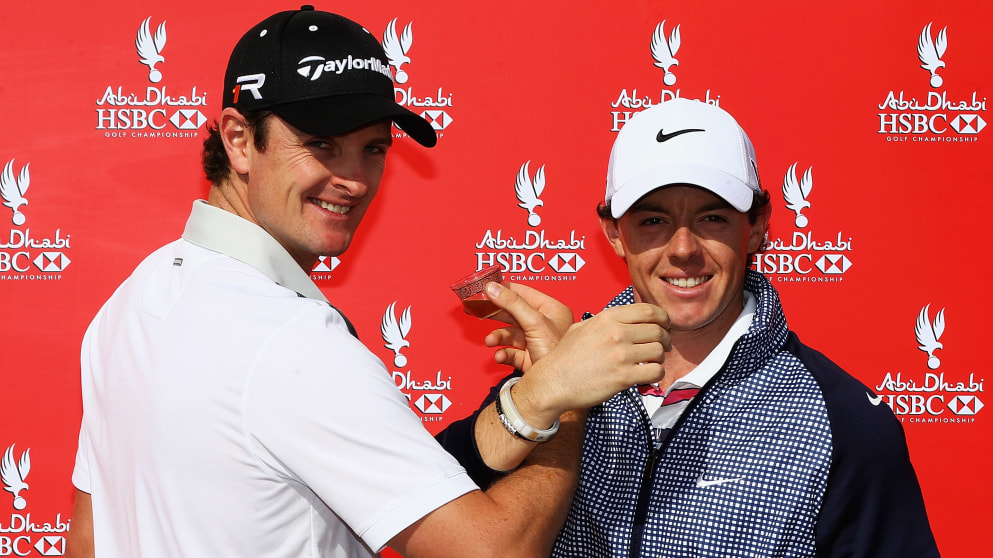 Justin Rose and Rory McIlroy drink coffee 