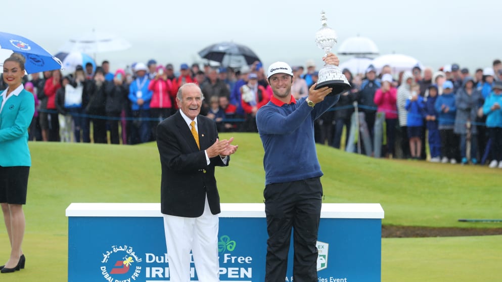 Colm McLoughlin, Executive Vice-Chairman and CEO of Dubai Duty Free, presents Jon Rahm with the trophy for the 2017 Dubai Duty Free Irish Open hosted by the Rory Foundation, 