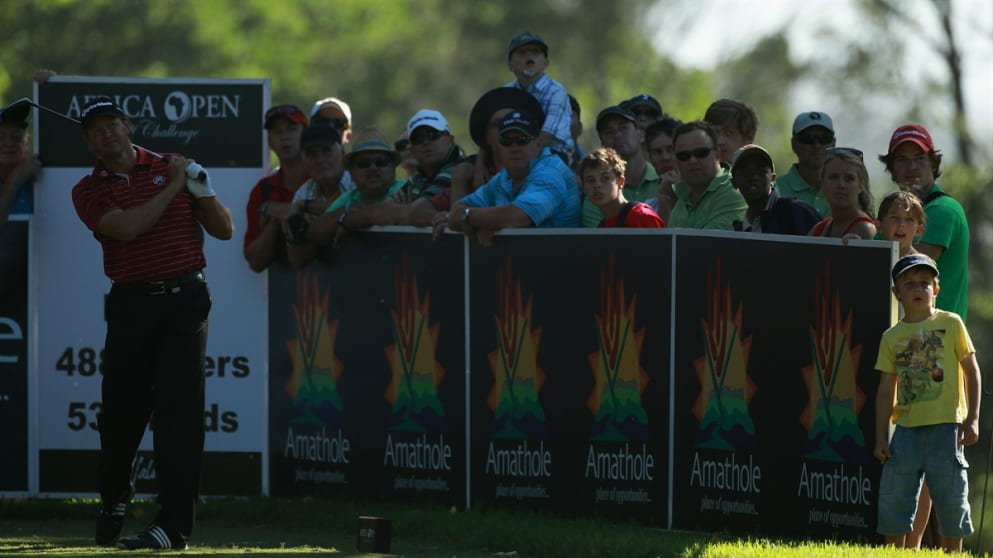 A young fan watches Retief Goosen in action