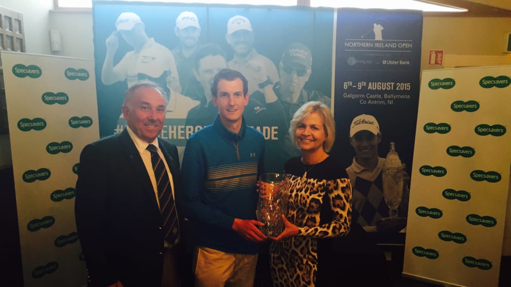 2015 North of Ireland Amateur Strokeplay winner Tiarnan McLarnon (Massereene GC) with Valerie Penney (Specsavers Ballymena) and Galgorm Castle Golf Club Captain Keith Dinsmore.
