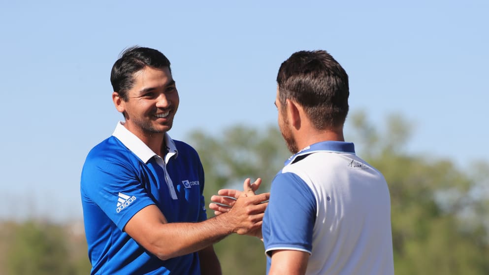 Jason Day of Australia shakes hands with Louis Oosthuizen after beating the South African in the final of the WGC - Dell Match Play