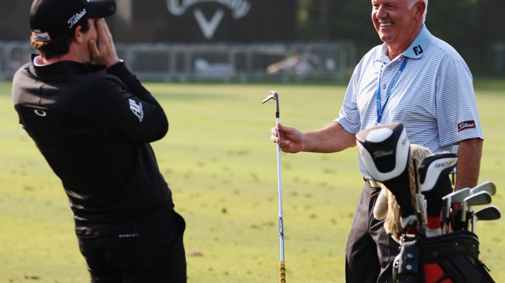 Rory McIlroy of Northern Ireland laughs at father Gerry McIlroy