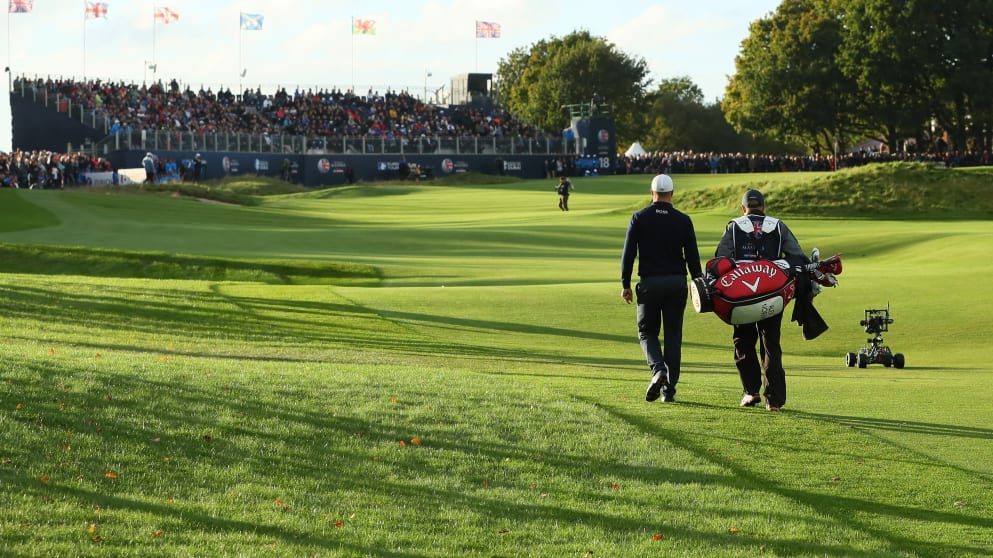 Alex Noren walks up the 18th