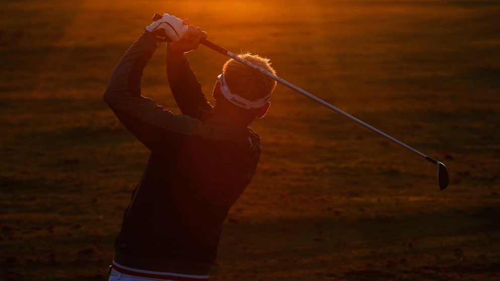 Soren Kjeldsen warms up as the sun rises in the Netherlands