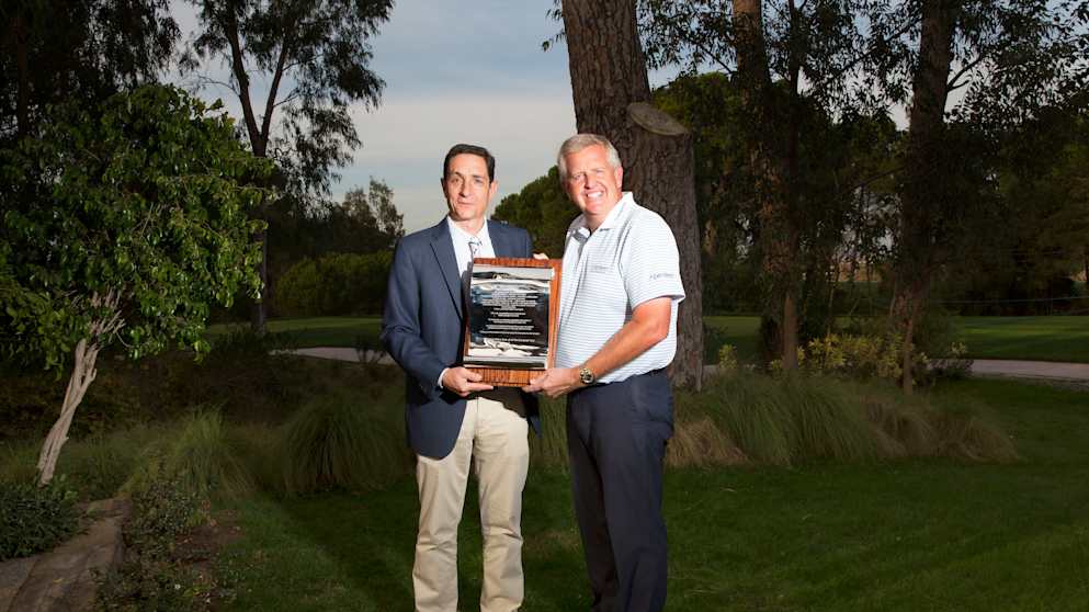 Miguel Vidaor, Tournament Director of the Turkish Airlines Open, presents Colin Montgomerie with a silver scroll (pic by Kevin Murray)