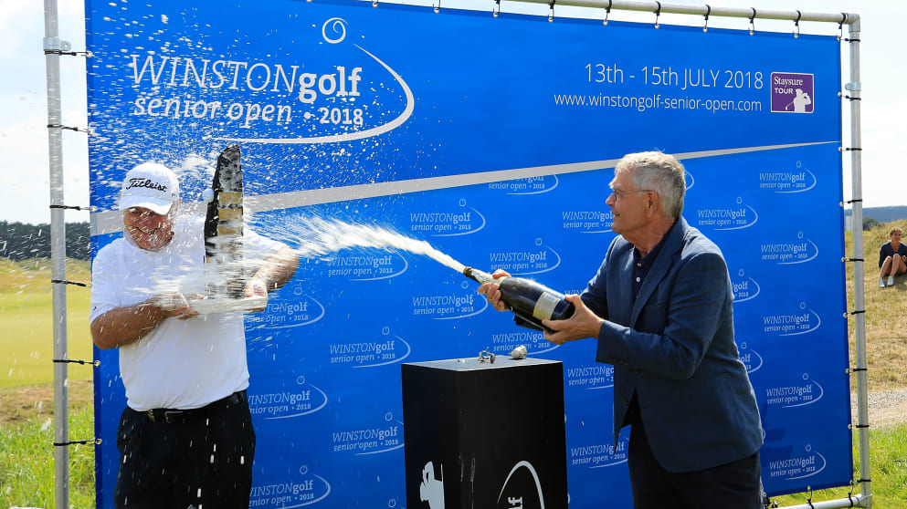 Mr. Pon showers Stephen Dodd in champagne after winning on his birthday (credit Phil Inglis)