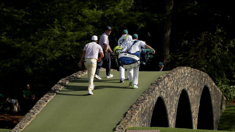 Francesco Molinari and Jason Day walk across the Hogan Bridge