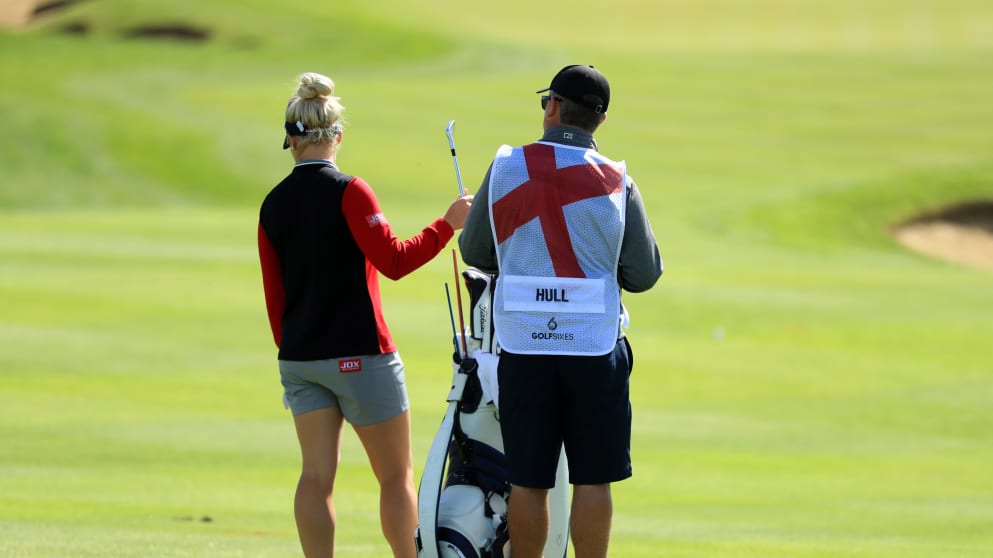 Charley Hull and her caddie assess a shot on the 4th hole during the GolfSixes Pro-Am