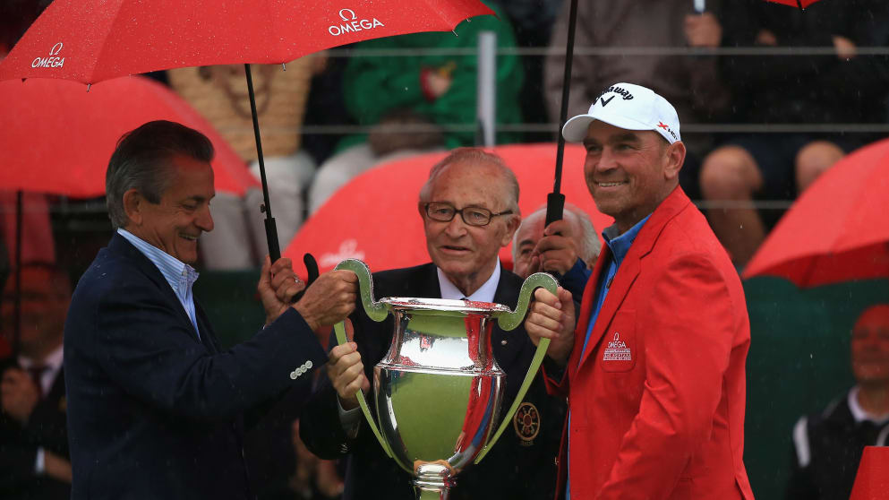 Stephen Urquhart, President of Omega and Gaston Barras, President of the Organising Committee present Thomas Bjorn of Denmark with the trophy during the final round of the Omega European Masters