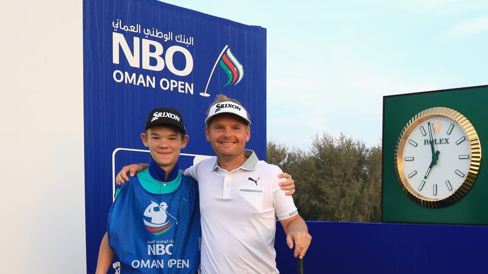 Soren Kjeldsen of Denmark is pictured with his son and caddie Emil