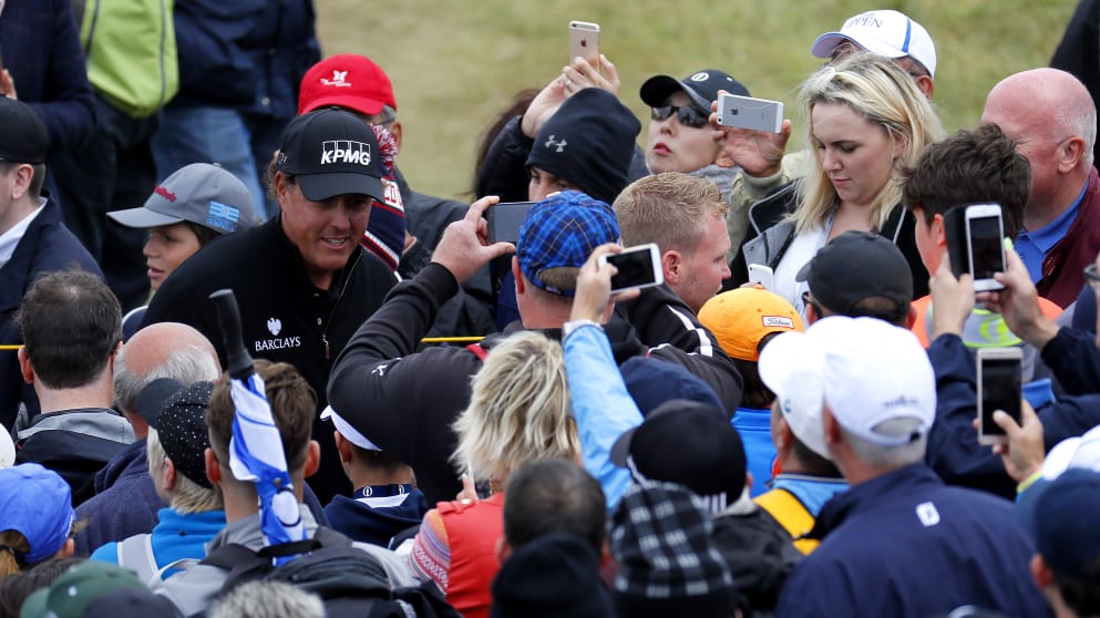Phil Mickelson - walks through the crowds on the way to the fifth hole during the final round of the 145th Open Championship