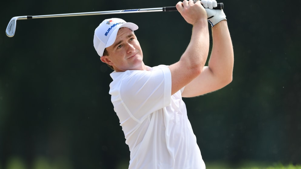 Paul Dunne plays a shot during practice prior to the start of the Eurasia Cup 