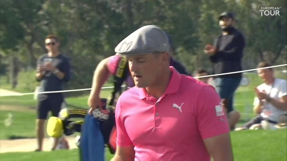 DeChambeau chips in from the rough
