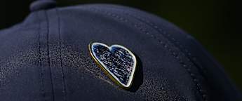 Commemorative pin designed as tributes made to Crans-Montana fire tragedy victims