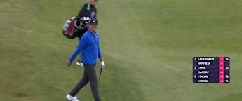 Wenyi Ding chips in from the rough on the third