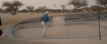 Daniel Hillier and David Micheluzzi try out sand golf at Bahrain's oldest course